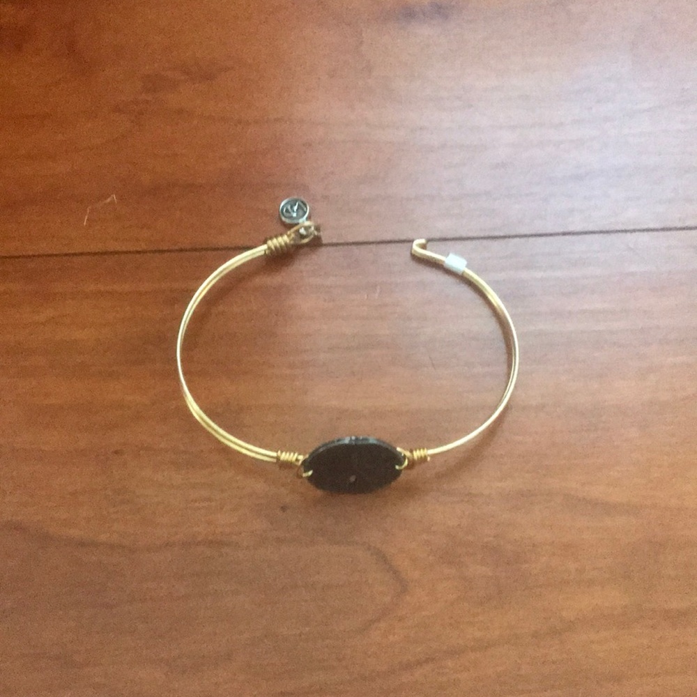 1 Gold sand dollar bracelet.